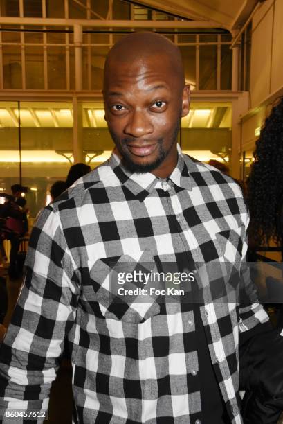 Singer Singuila attends the "Afro" Rokhaya Diallo and photographer Brigitte Sombie Exhibition at Maison des Metallos on October 11, 2017 in Paris,...