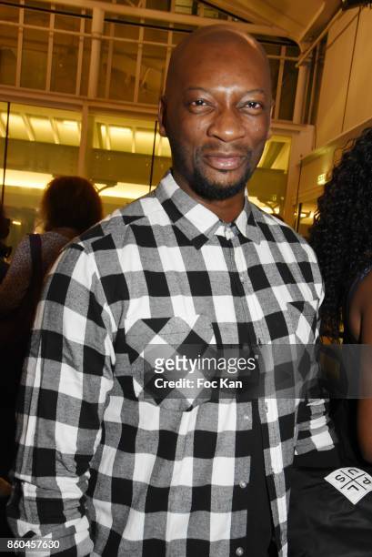 Singer Singuila attends the "Afro" Rokhaya Diallo and photographer Brigitte Sombie Exhibition at Maison des Metallos on October 11, 2017 in Paris,...