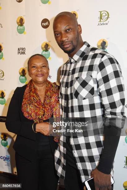 Christiane Taubira and singer Singuila attend the "Afro" Rokhaya Diallo and photographer Brigitte Sombie Exhibition at Maison des Metallos on October...