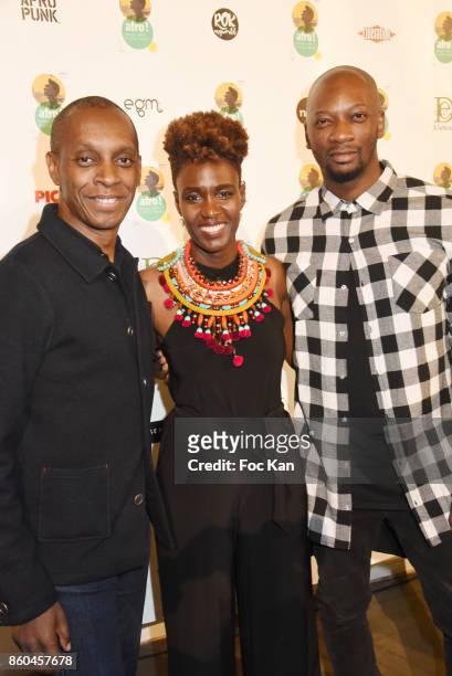 Singer Claudy Siar, Rokhaya Diallo and Singuila attend the "Afro" Rokhaya Diallo and photographer Brigitte Sombie Exhibition at Maison des Metallos...