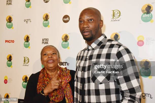 Christiane Taubira and singer Singuila attend the "Afro" Rokhaya Diallo and photographer Brigitte Sombie Exhibition at Maison des Metallos on October...