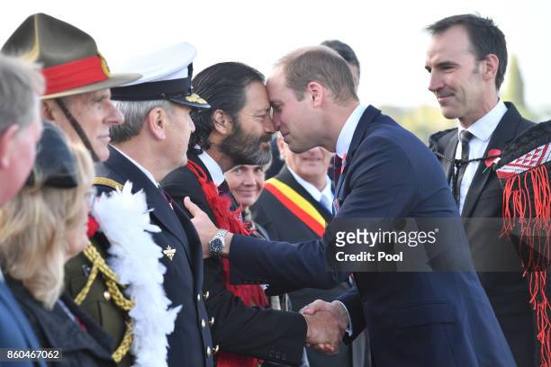 Prince William, Duke of Cambridge, is greeted by Former Corporal in the New Zealand Special Air Service and Victoria Cross awardee Bill Henry...
