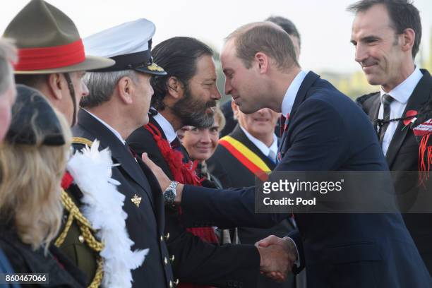 Prince William, Duke of Cambridge, is greeted by Former Corporal in the New Zealand Special Air Service and Victoria Cross awardee Bill Henry...