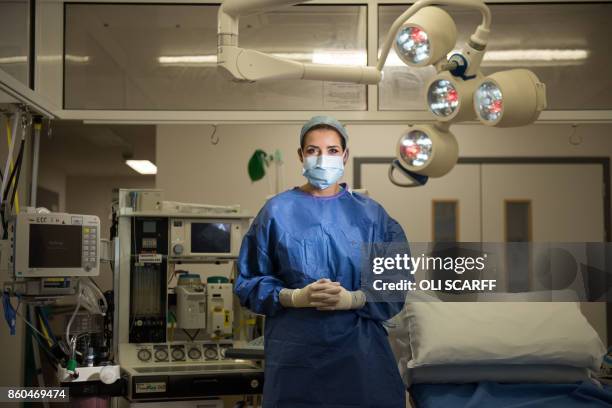 Sara Dalby, a surgical care practitioner, poses for a photograph in an operating theatre inside the Elective Care Centre building of Aintree...