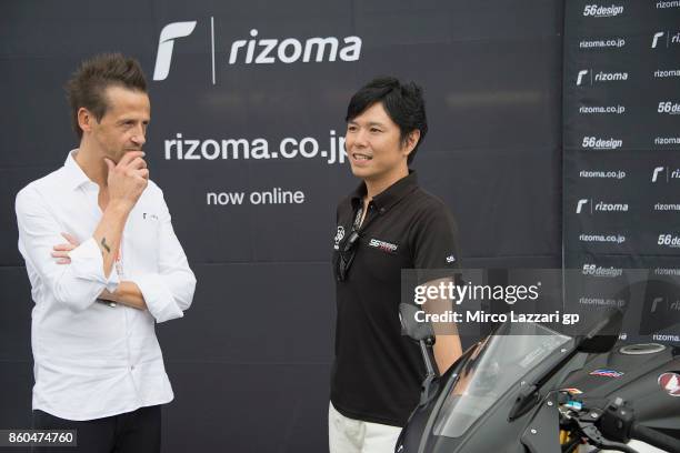 Fabrizio Rigolio of Italy and Rizoma pose with Shinyia Nakano of Japan in pit during the Rizoma Japan presentation during the MotoGP of Japan -...