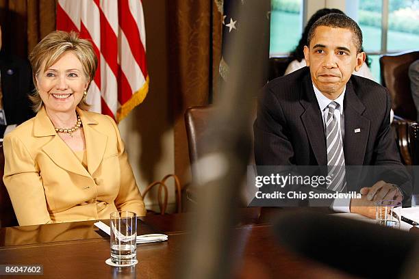 President Barack Obama takes a question from the news media after conducting his first cabinet meeting with Secretary of State Hillary Clinton and...