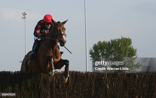 Royal Wedding ridden by Liam Treadwell jumps en-route to winning The Betlive & In-Running @williamhill.com Handicap Steeple Chase is raced at Kempton...