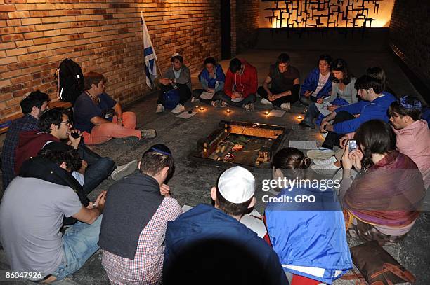 In this handout photo provided by the Israeli Government Press Office , Jewish teenagers from Sweden participating in The March of the Living holding...