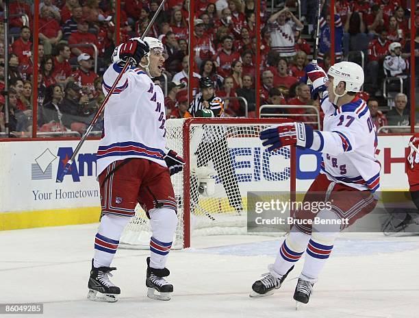 Ryan Callahan of the New York Rangers scores at 7:44 of the first period against the Washington Capitals and is greeted by Brandon Dubinsky during...