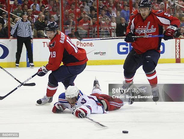 Nikolai Zherdev of the New York Rangers skates against Nicklas Backstrom and Mike Green of the Washington Capitals during Game Two of the Eastern...
