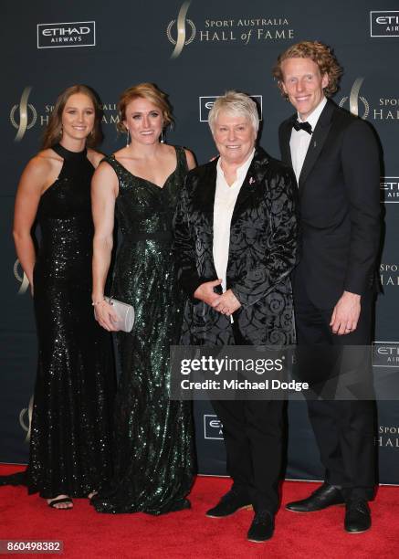 Raelene Boyle is flanked by rising Andre Russell of the Thunder track and field athlete Riley Day World and Olympics Champion hurdler Sally Pearson...