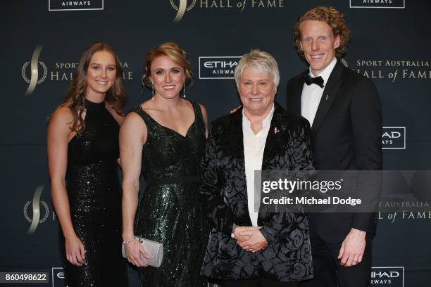 Raelene Boyle is flanked by rising Andre Russell of the Thunder track and field athlete Riley Day World and Olympics Champion hurdler Sally Pearson...