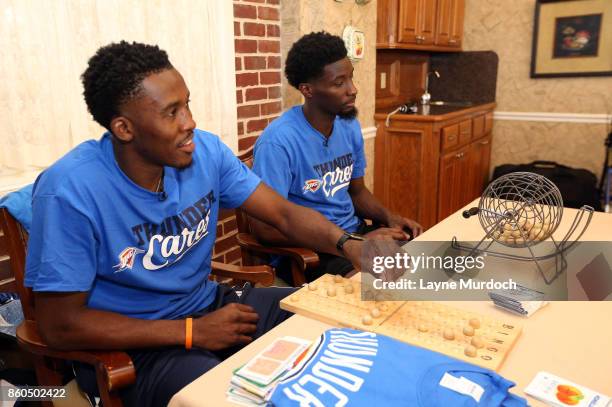 Semaj Christon and Daniel Hamilton of the Oklahoma City Thunder play bingo with local senior citizens on September 21, 2017 at the Brookdale Village...