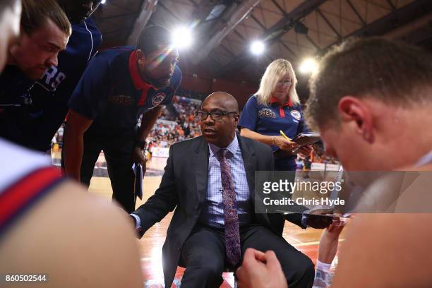 36ers coach Joey Wright speaks to players during the round two NBL match between the Cairns Taipans and the Adelaide 36ers at Cairns Convention...