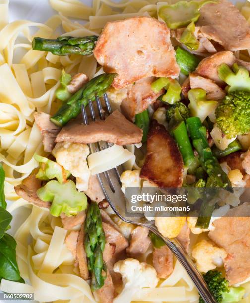 rice noodles rolled on a fork. grilled chicken kebab with vegetables and pasta - pasta fork stock pictures, royalty-free photos & images