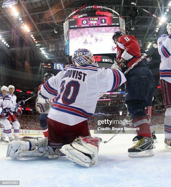 Henrik Lundqvist of the New York Rangers defends against Alexander Ovechkin of the Washington Capitals during Game Two of the Eastern Conference...