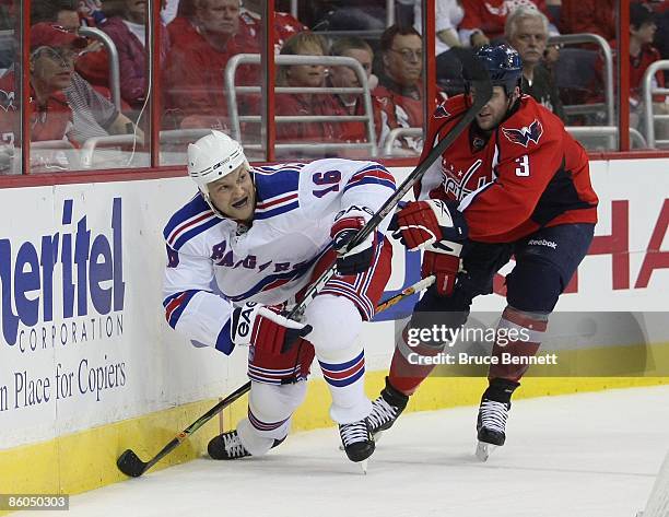 Sean Avery of the New York Rangers skates against Tom Poti of the Washington Capitals during Game Two of the Eastern Conference Quarterfinal Round of...