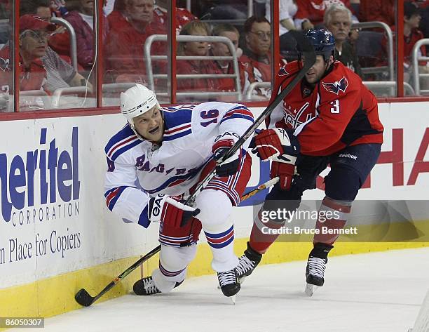 Sean Avery of the New York Rangers skates against Tom Poti of the Washington Capitals during Game Two of the Eastern Conference Quarterfinal Round of...