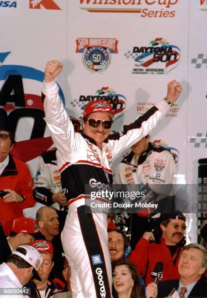 Driver Dale Earnhardt celebrates in Victory Lane after winning the Daytona 500 race on February 15, 1998 at the Daytona International Speedway in...