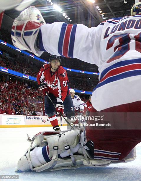 Henrik Lundqvist of the New York Rangers tends net against Sergei Fedorov of the Washington Capitals during Game Two of the Eastern Conference...