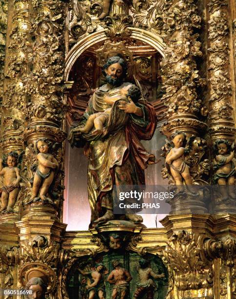 Saint Joseph with the Child Jesus, polychrome wood sculpture by Pau Costa. Dated between 1706-1711. Main altarpiece of the Church of Santa Maria....