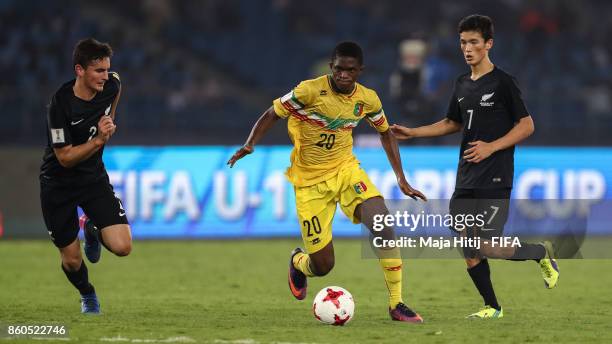 Cheick Oumar of Mali Doucoure and Elijah Just of New Zealand battle for the ball during the FIFA U-17 World Cup India 2017 group A match between Mali...