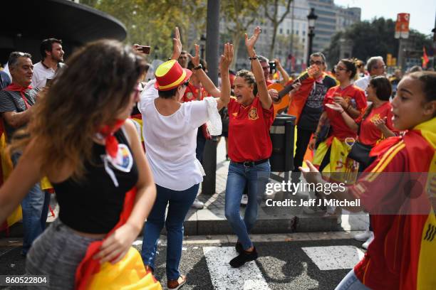 Thousands gather in Barcelona for a Spanish National Day Rally on October 12, 2017 in Barcelona, Spain. Spain marked its National Day with a show of...