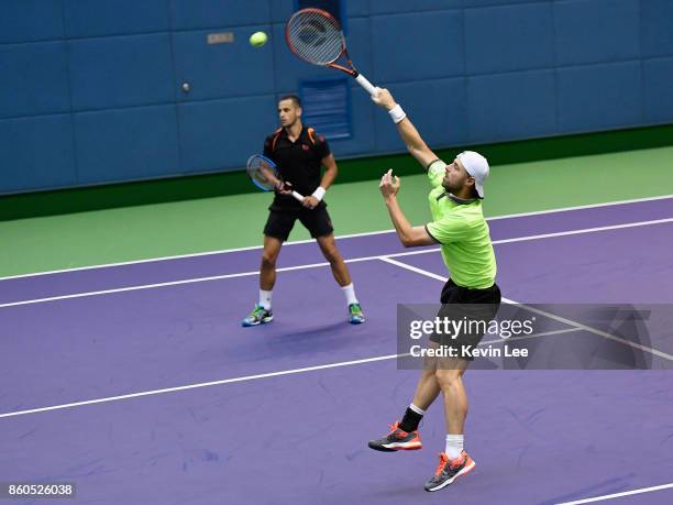 Oliver Marach of Austria and Mate Pavic of Croatia in action in the match between Wu Di of China and Wu Yibing of China and Oliver Marach of Austria...