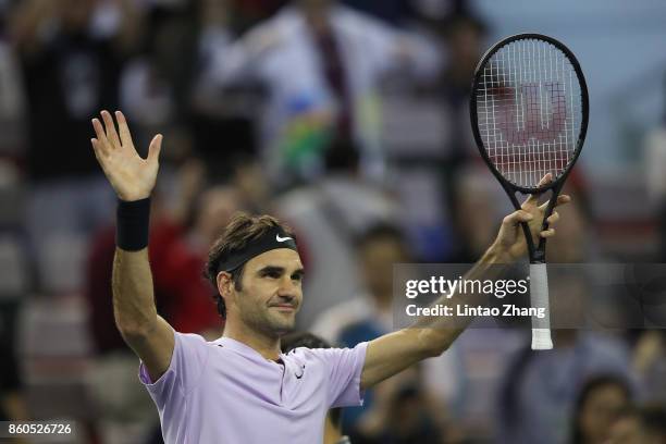 Roger Federer of Switzerland celebrates after winning the Men's singles third round match against Alexandr Dolgopolov of Ukraine on day five of 2017...