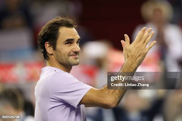 Roger Federer of Switzerland celebrates after winning the Men's singles third round match against Alexandr Dolgopolov of Ukraine on day five of 2017...