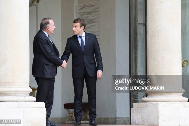 French President Emmanuel Macron shakes hand with head of the employers federation MEDEF, Pierre Gattaz following their meeting at the Elysee Palace...