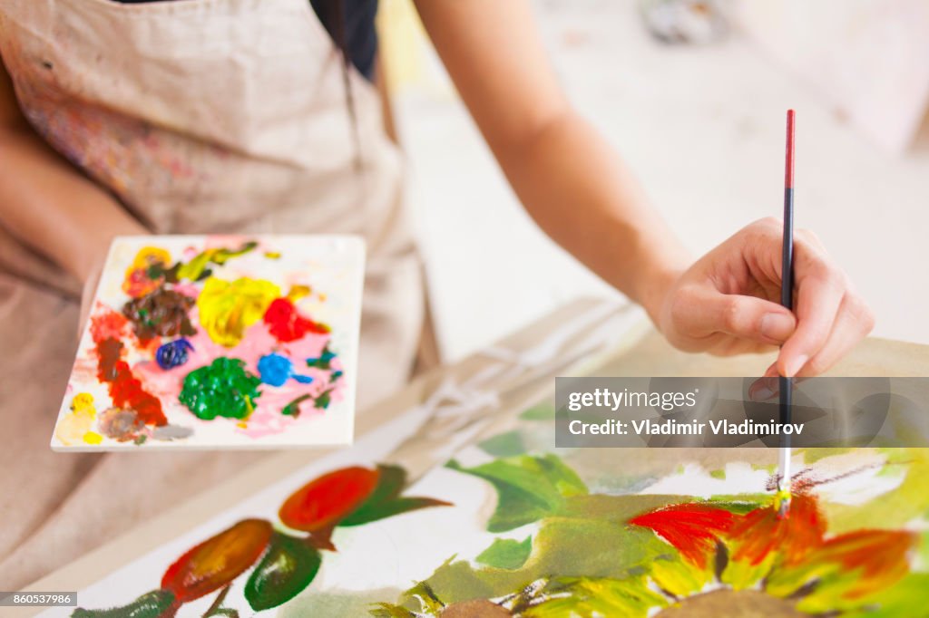 Female artist working in studio