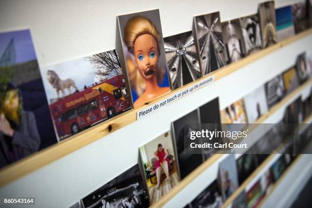 Postcards featuring images by photographers including Martin Parr and Wolfgang Tillmans are displayed ahead of a secret raffle at ThePrintSpace...