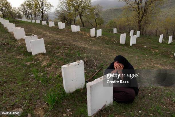 Next to the village, graves have been dug for the Kurds that were killed during the Anfal, a series of genocide campaigns Saddam Hussein led from...