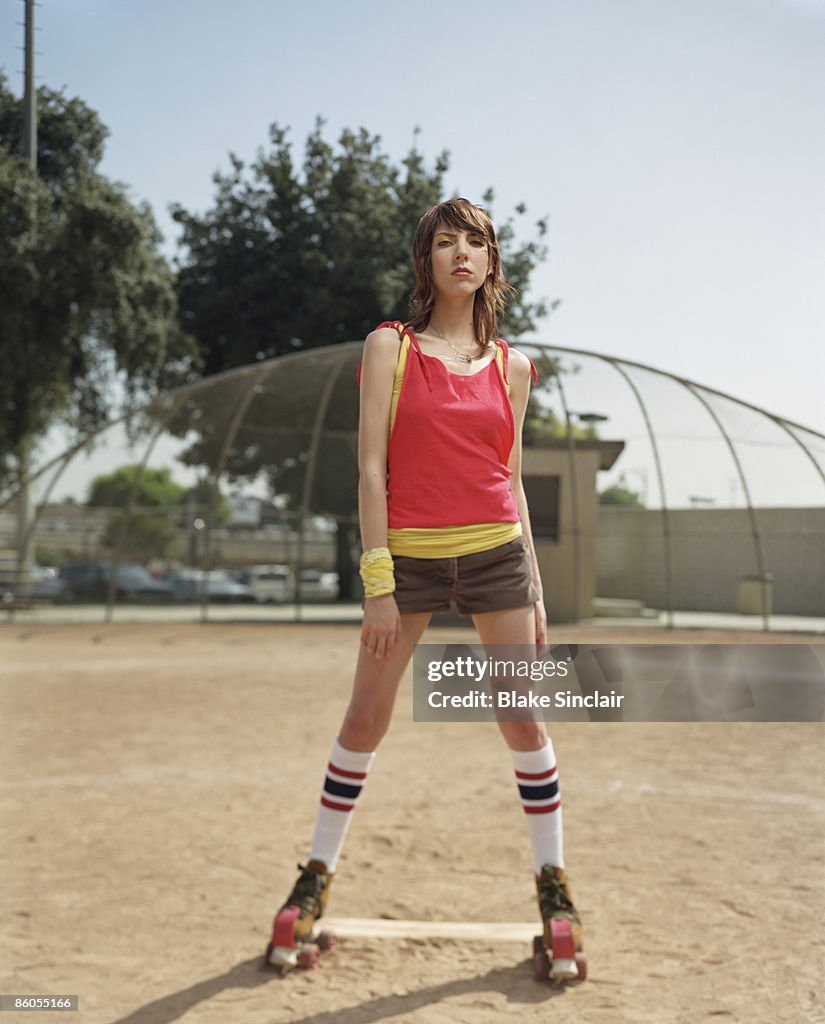 Young adult woman wearing roller skates