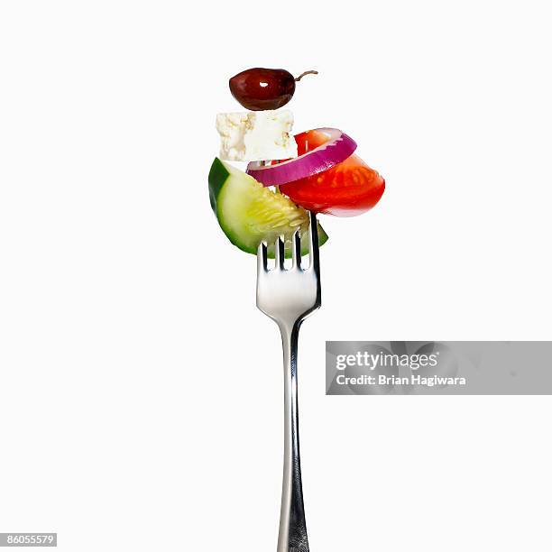 greek salad on a fork - feta cheese imagens e fotografias de stock