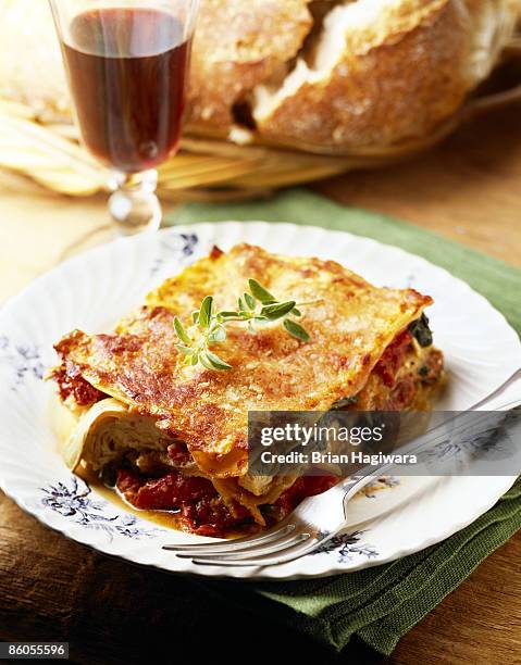 vegetable lasagna - serving lasagna stock pictures, royalty-free photos & images