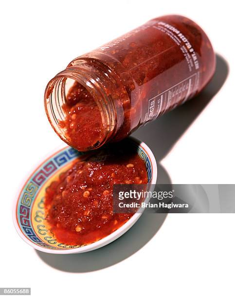 garlic chili sauce - pouring sauce stock pictures, royalty-free photos & images