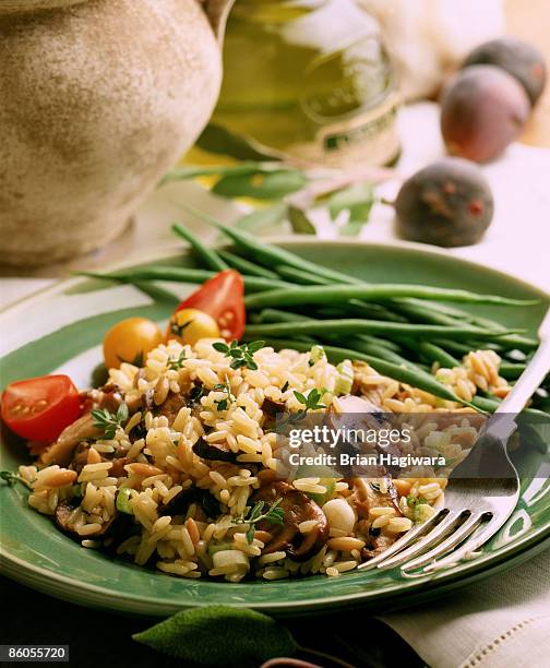 rice pilaf with olives and mushrooms - pilafrijst stockfoto's en -beelden