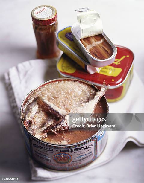 packaged sardines and anchovies - anchovy stock pictures, royalty-free photos & images