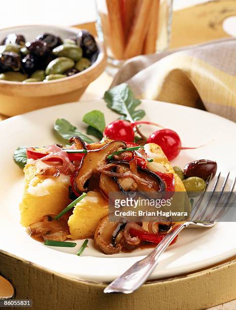 polenta with mushrooms , peppers , and onions - polenta fotografías e imágenes de stock