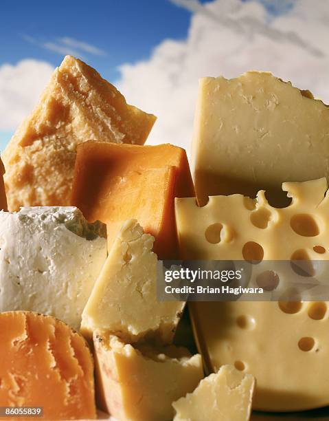 mountain of cheese with sky - cheeses stock-fotos und bilder