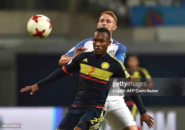 Andres Cifuentes of Colombia and Josh Sargent of USA vie for a ball during the group stage football match between USA and Colombia in the FIFA U-17...