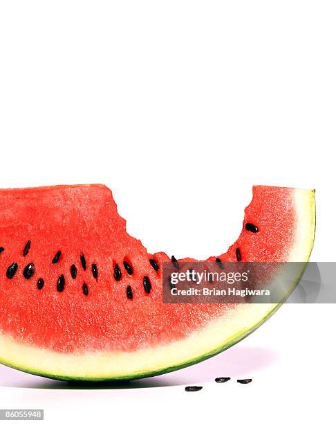 wedge of watermelon - biting stock-fotos und bilder