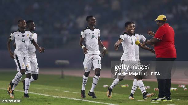 Eric Ayiah of Ghana celebrates with his team-mates and head coach Samuel Fabin after scoring his team's second goal to make it 2-0 during the FIFA...