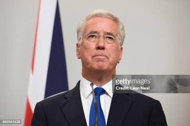 Britain's Defence Secretary Michael Fallon addresses members of the media during a joint UK/Poland press conference in the Foreign and Commonwealth...