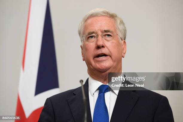 Britain's Defence Secretary Michael Fallon addresses members of the media during a joint UK/Poland press conference in the Foreign and Commonwealth...