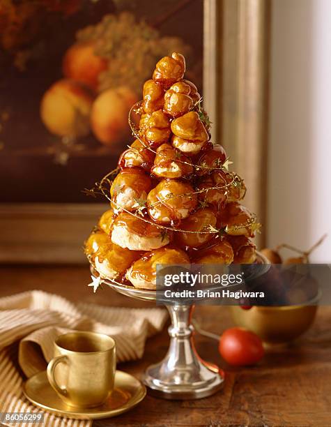 croquembouche with tinsel - profiterole stock pictures, royalty-free photos & images