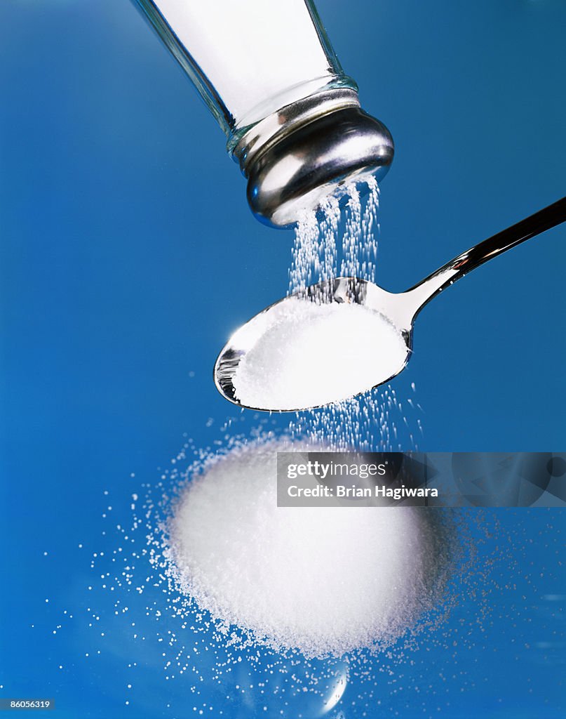Salt pouring into spoon