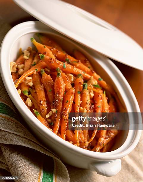 glazed baby carrots with walnuts - candied walnuts stock pictures, royalty-free photos & images